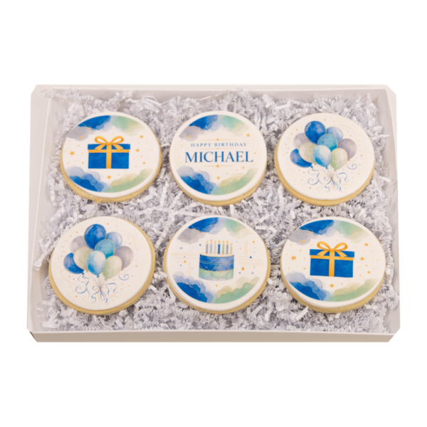Complete open Boy Birthday Cookie Gift Box with six sugar cookies on a transparent background