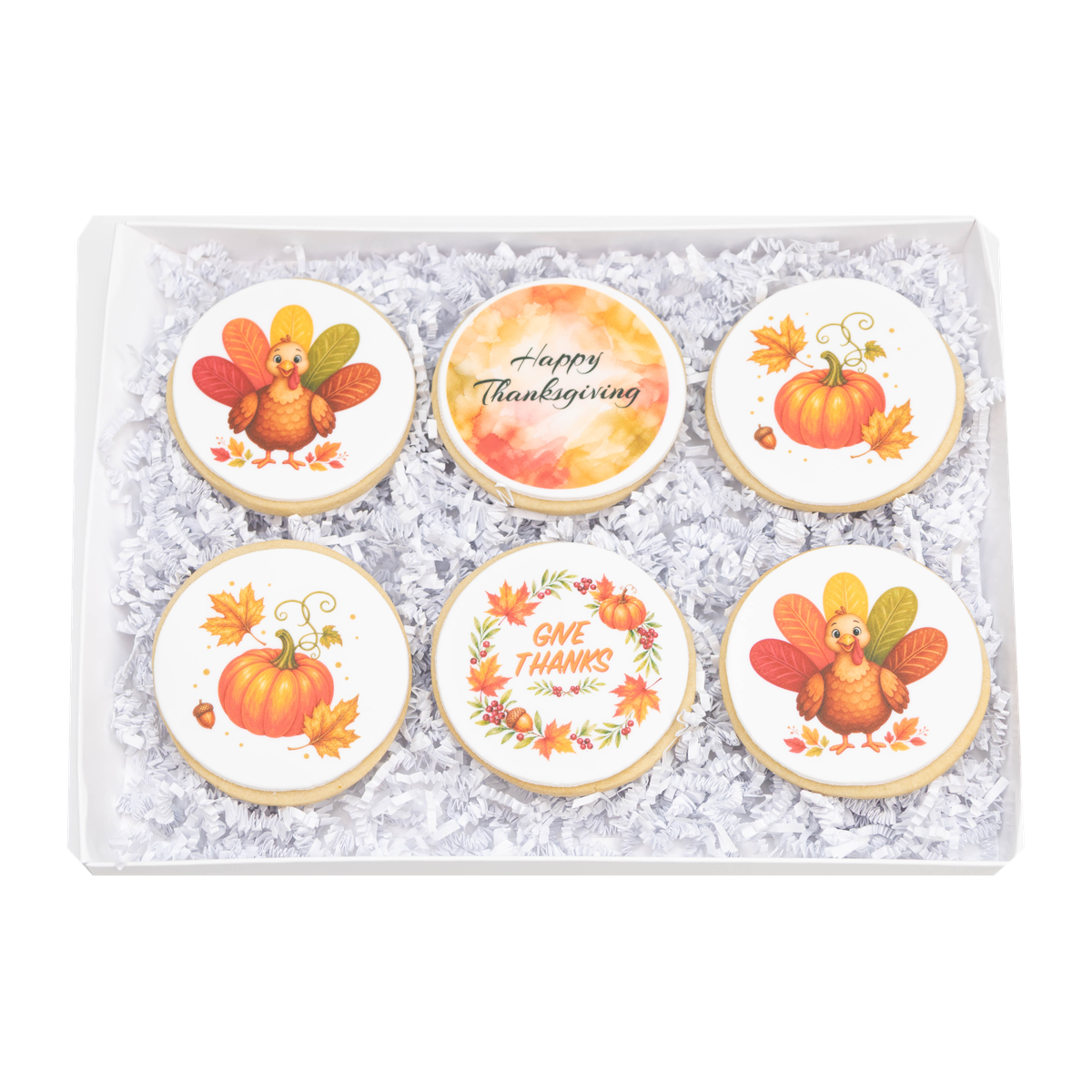 Open Thanksgiving cookie gift box with six sugar cookies featuring turkey, pumpkins, pie, autumn leaves, and gratitude messages